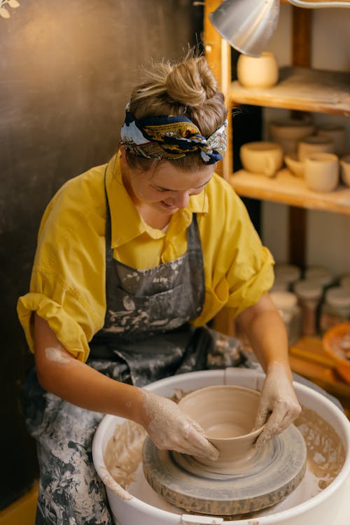 Close-Up Shot of a Woman Making a Clay Pot
