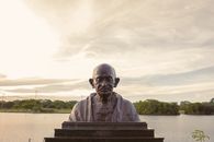 Man Statue Near Body of Water