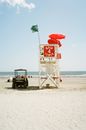 A Beach Buggy and Lifeguard Tower on the Beach