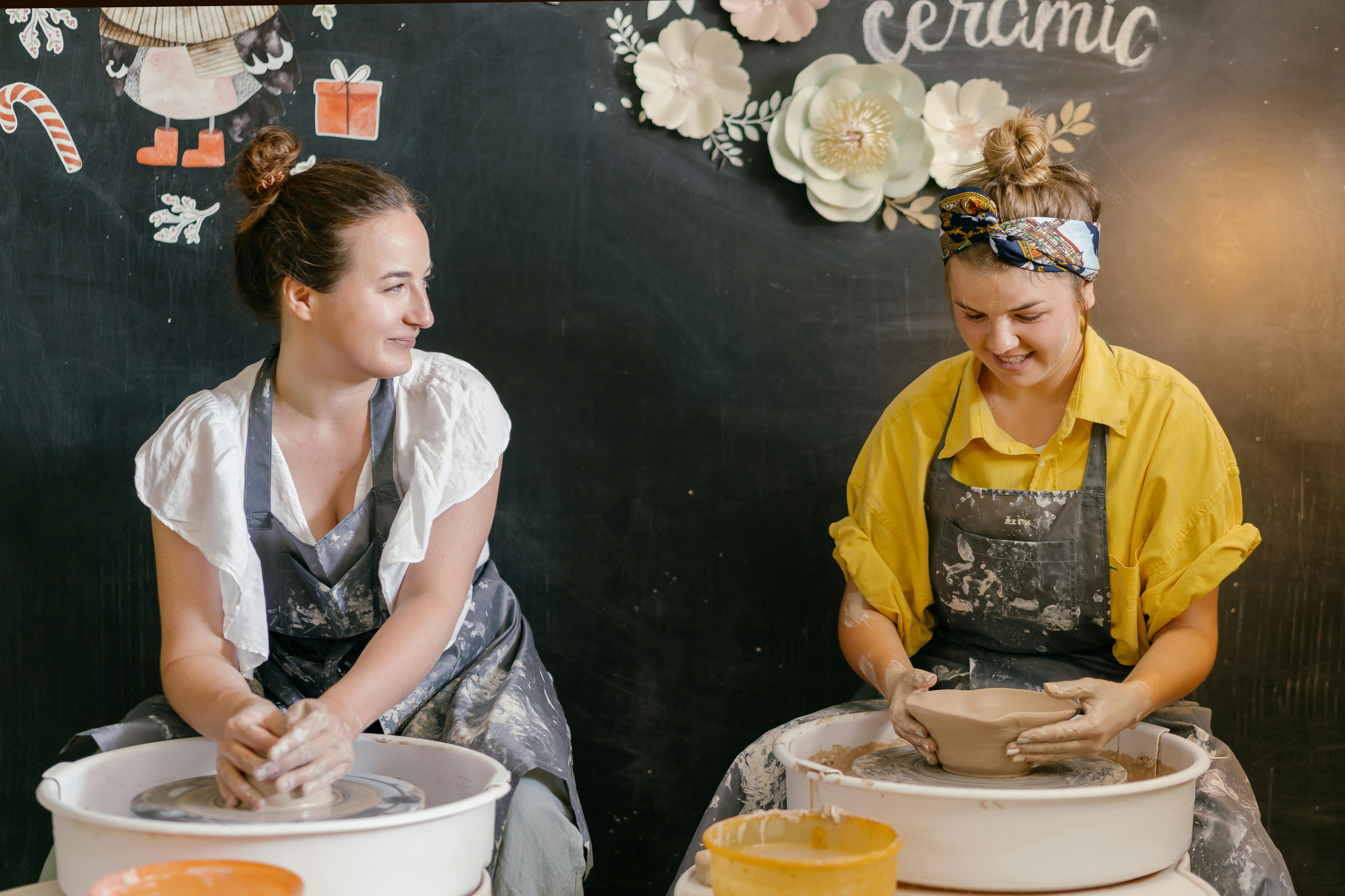 women working as potters in workshop