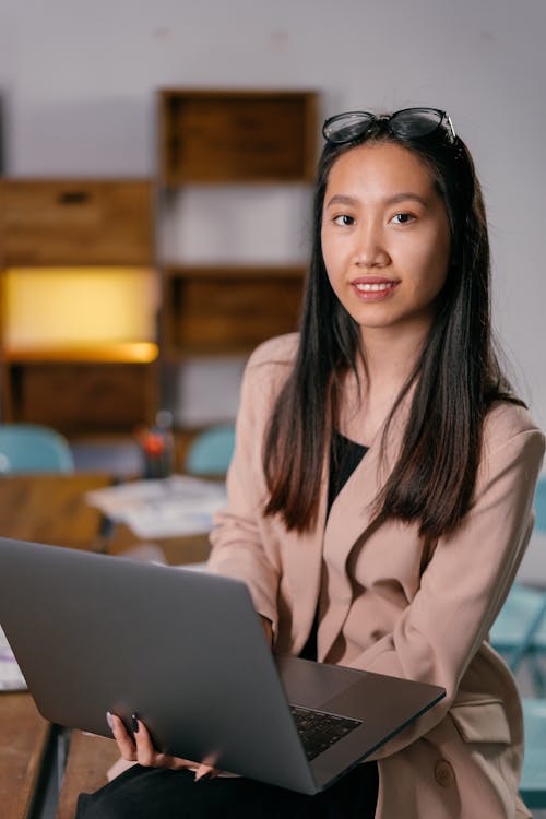 Photograph of Woman with a Laptop Sitting