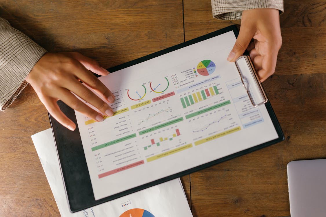 Free Charts and Graphs on Paper on a Clipboard Stock Photo