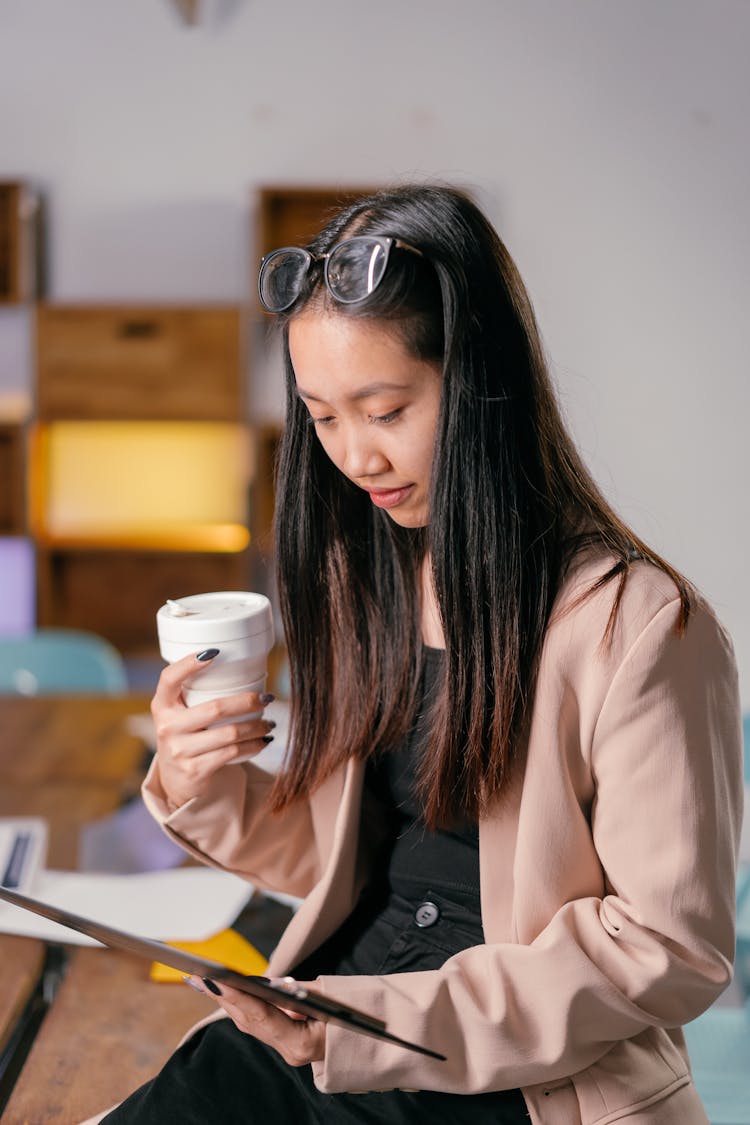 Focused Female Professional Looking At A Document 