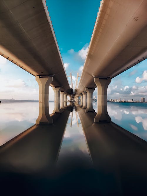 Concrete Bridges Reflecting on Calm Waters
