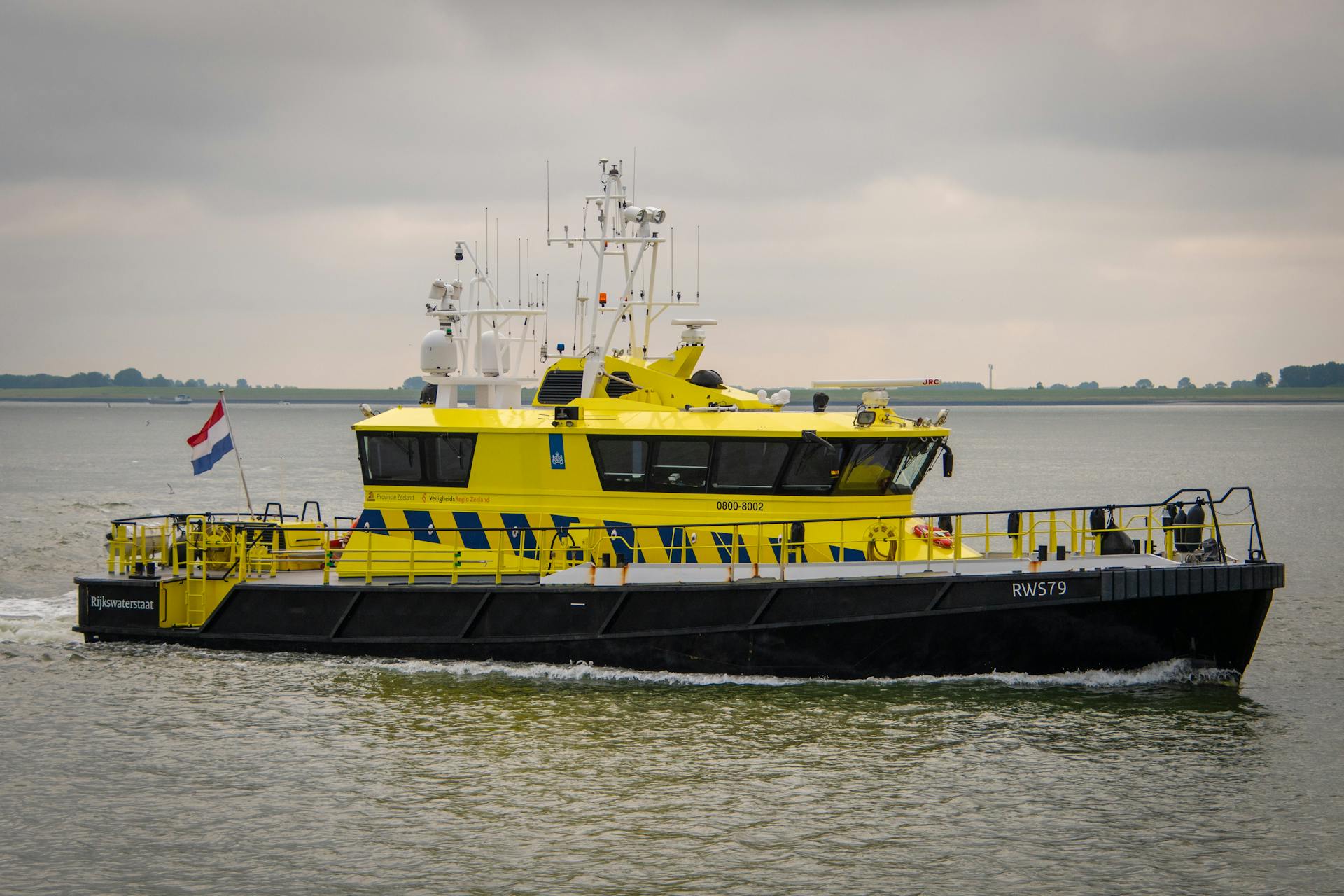 Yellow and Black Vessel Ship Sailing on the Ocean
