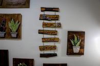 Beautiful handcrafted wooden plaques with string art and Arabic script, perfect for home decor.