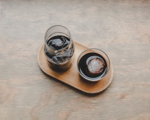 Free 2 Clear Glass Jars on Brown Wooden Tray Stock Photo