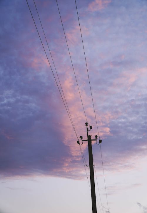An Electric Post Under a Cloudy Sky