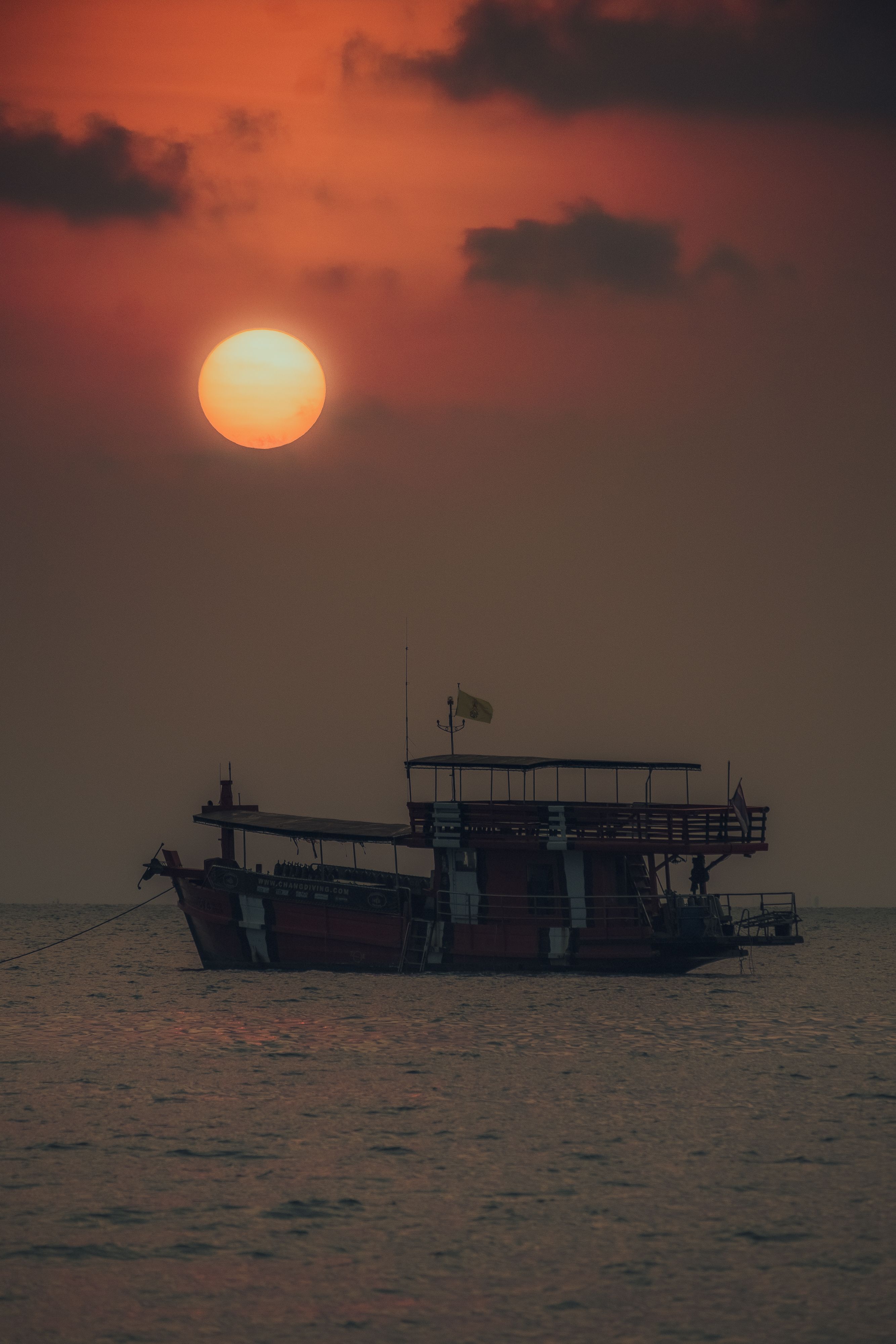 A Silhouette of a Fishing Boat on Sea during Sunset · Free Stock Photo