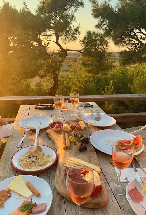 Free stock photo of dinner, glass of wine, golden sunset Stock Photo