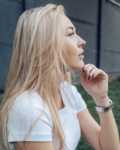 A Blonde Woman in a White Shirt