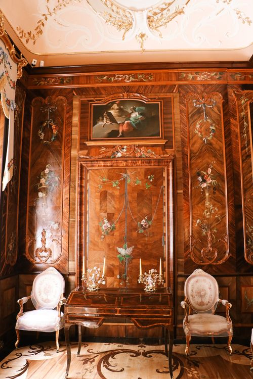 Free A luxurious vintage room featuring ornate woodwork and elegant furniture. Stock Photo