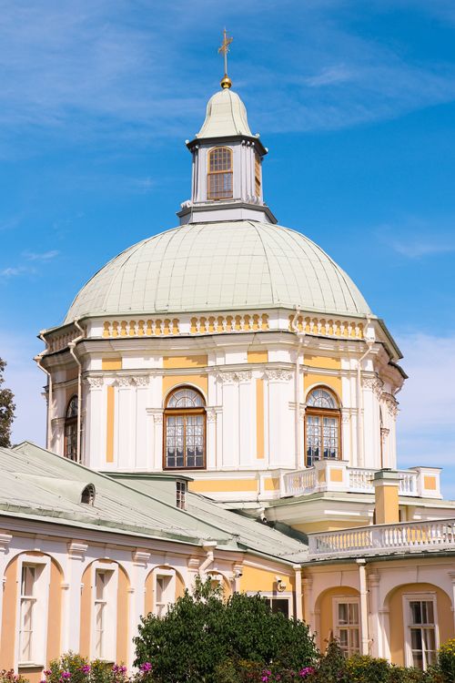 Free Beautiful baroque architecture featuring a church dome with ornate details against a clear blue sky. Stock Photo