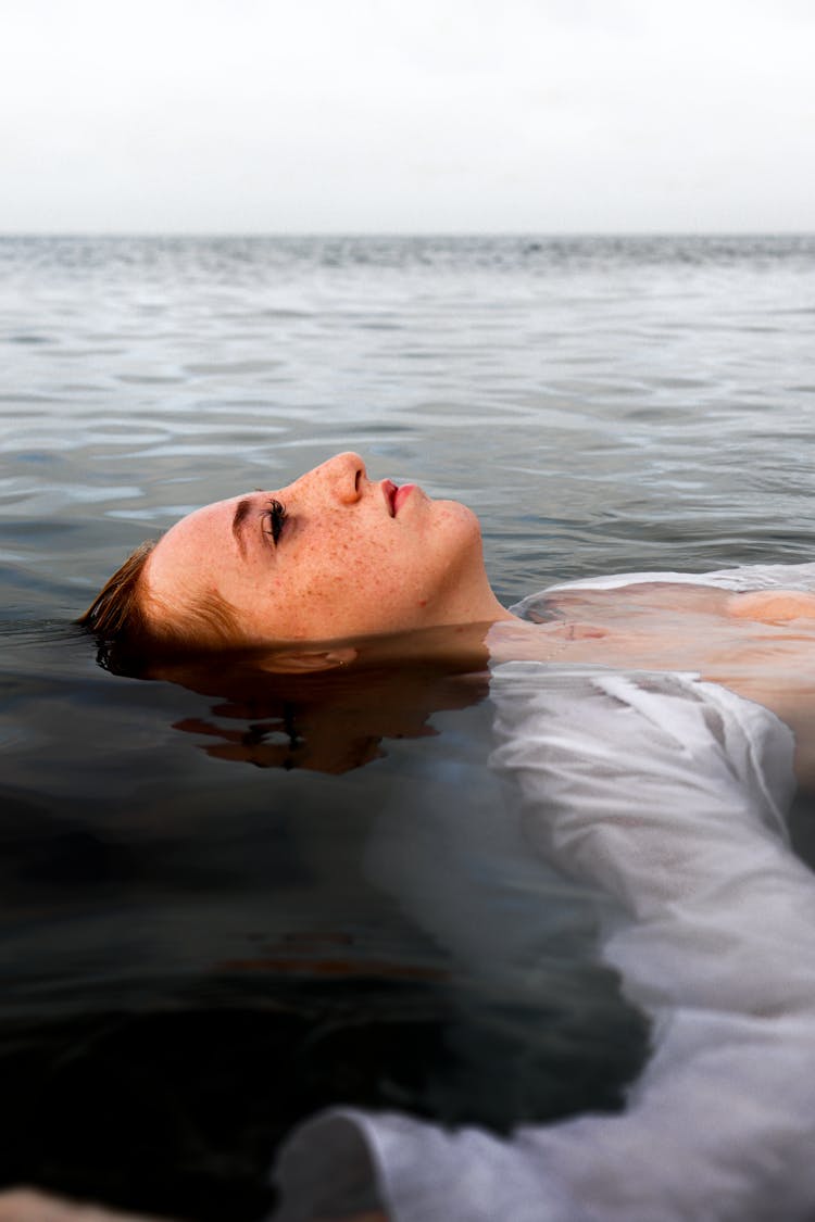 Woman Floating On Water 