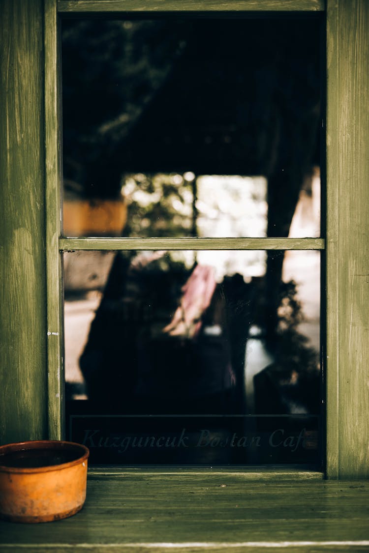 Close-up Of A Window With A Wooden Green Frame