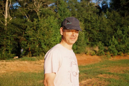 Portrait of a Man Wearing a Black Cap