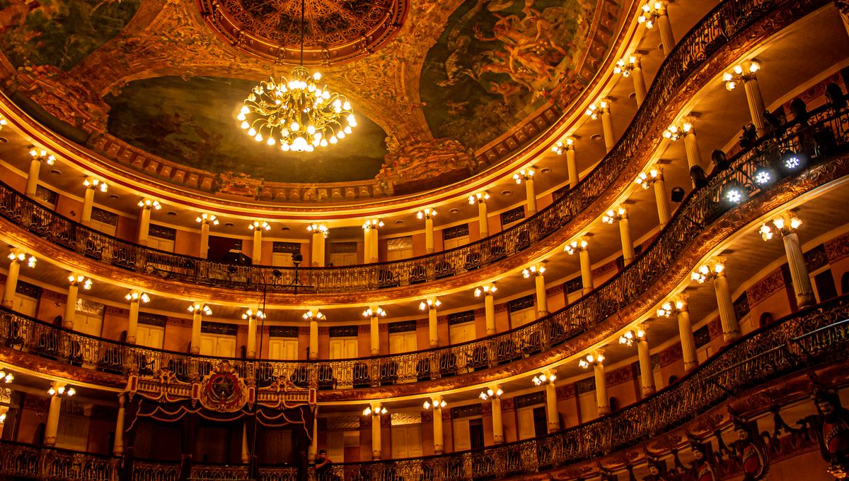 Golden opera-house auditorium with a chandelier