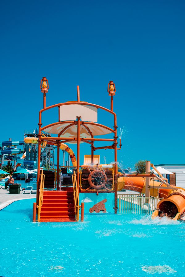 Colourful water park slides under a blue sky