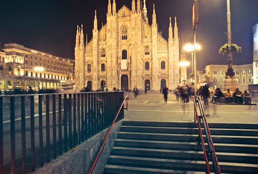 Captivating night scene of Milan Cathedral with lively city surroundings. by Andrea Piacquadio