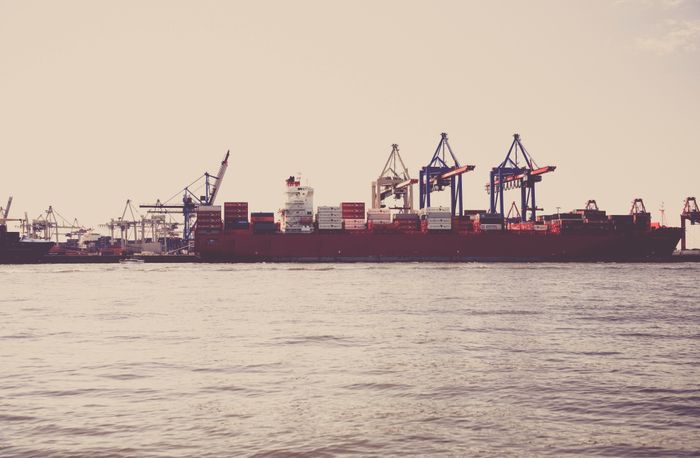 Cargo ship and crane at shipping port
