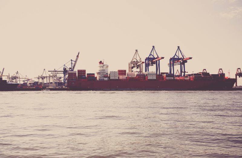 Cargo containers and crane at a shipping port