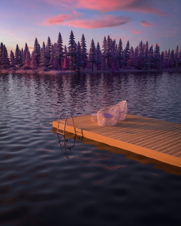 Free Chairs on a Jetty and a Scenic View of a Lake Stock Photo