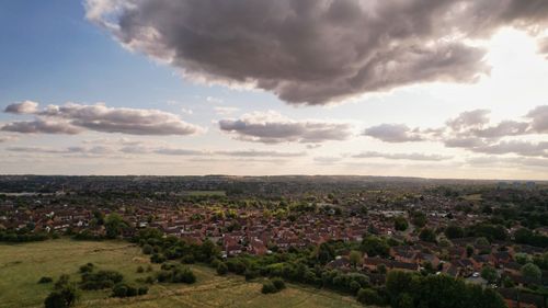 Free Aerial shot of the Luton countryside with houses and cloudy skies, showcasing rural England. Stock Photo