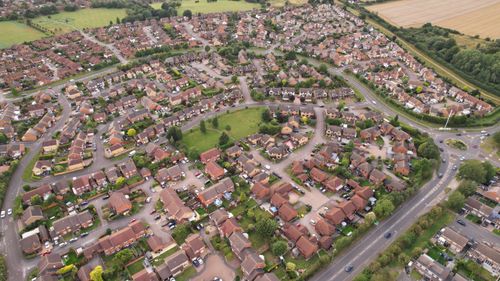 Free Aerial view of suburban houses in Luton, England, showcasing a vibrant residential area. Stock Photo