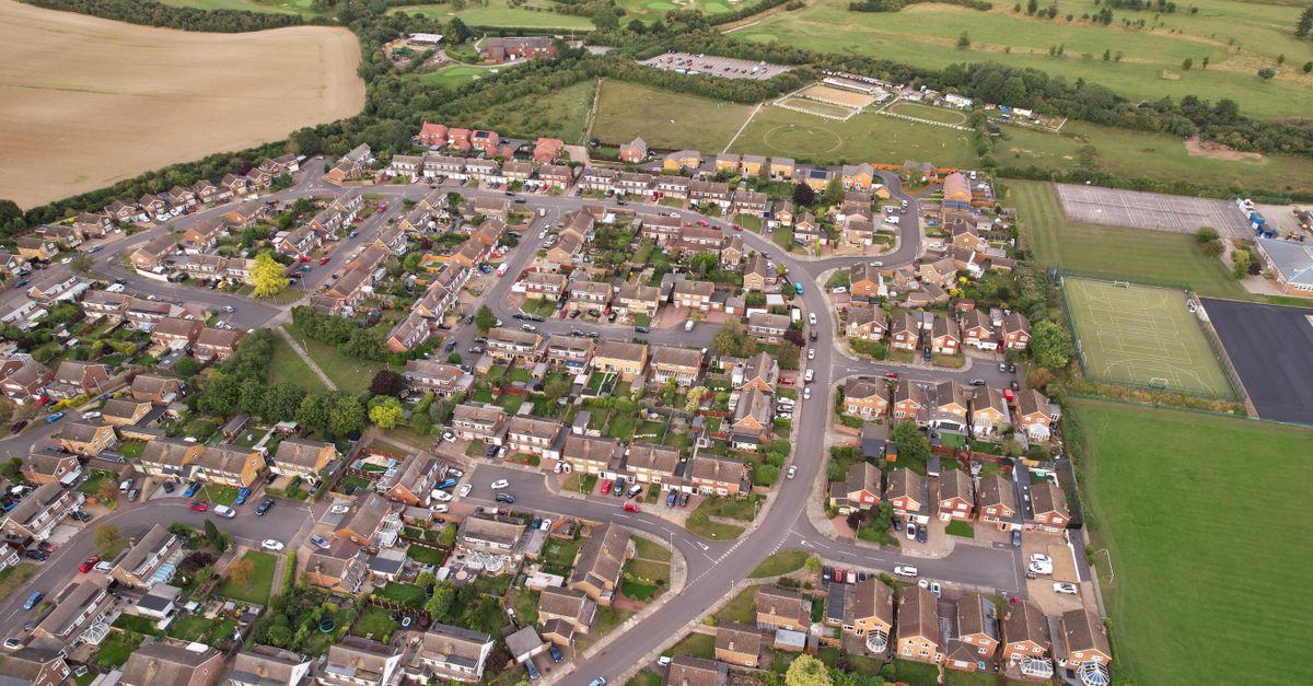 Aerial shot of a residential area in Luton, England surrounded by countryside.