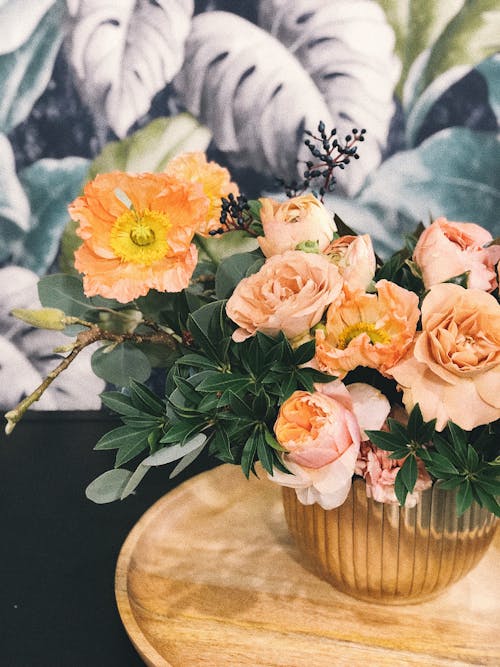 Free Peach Peony Flowers and Pink Poppy Flowers in Vase on Table Centerpiece Stock Photo