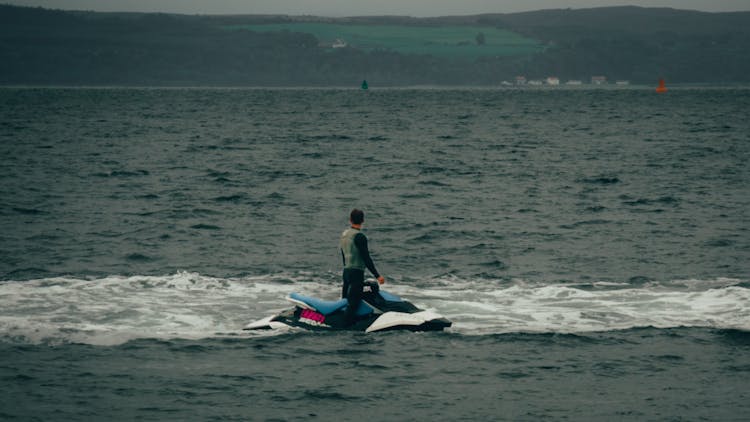 A Man Riding A Jetski