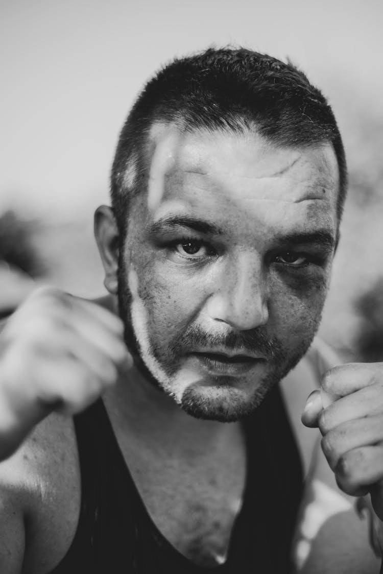 Grayscale Photo Of A Man In A Tank Top