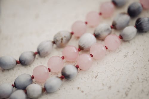 Free White and Pink Beads on White Surface Stock Photo