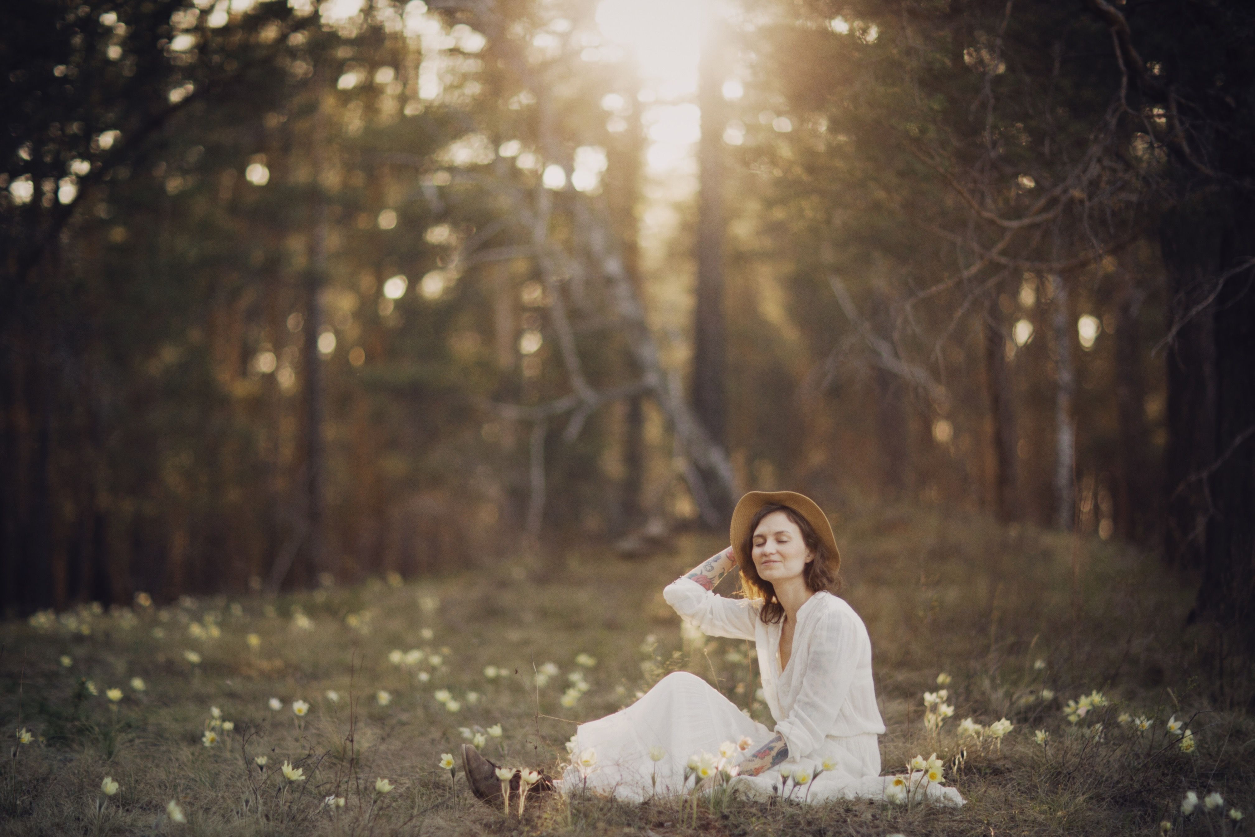 A Beautiful Woman in White Dress Sitting on Grass · Free Stock Photo