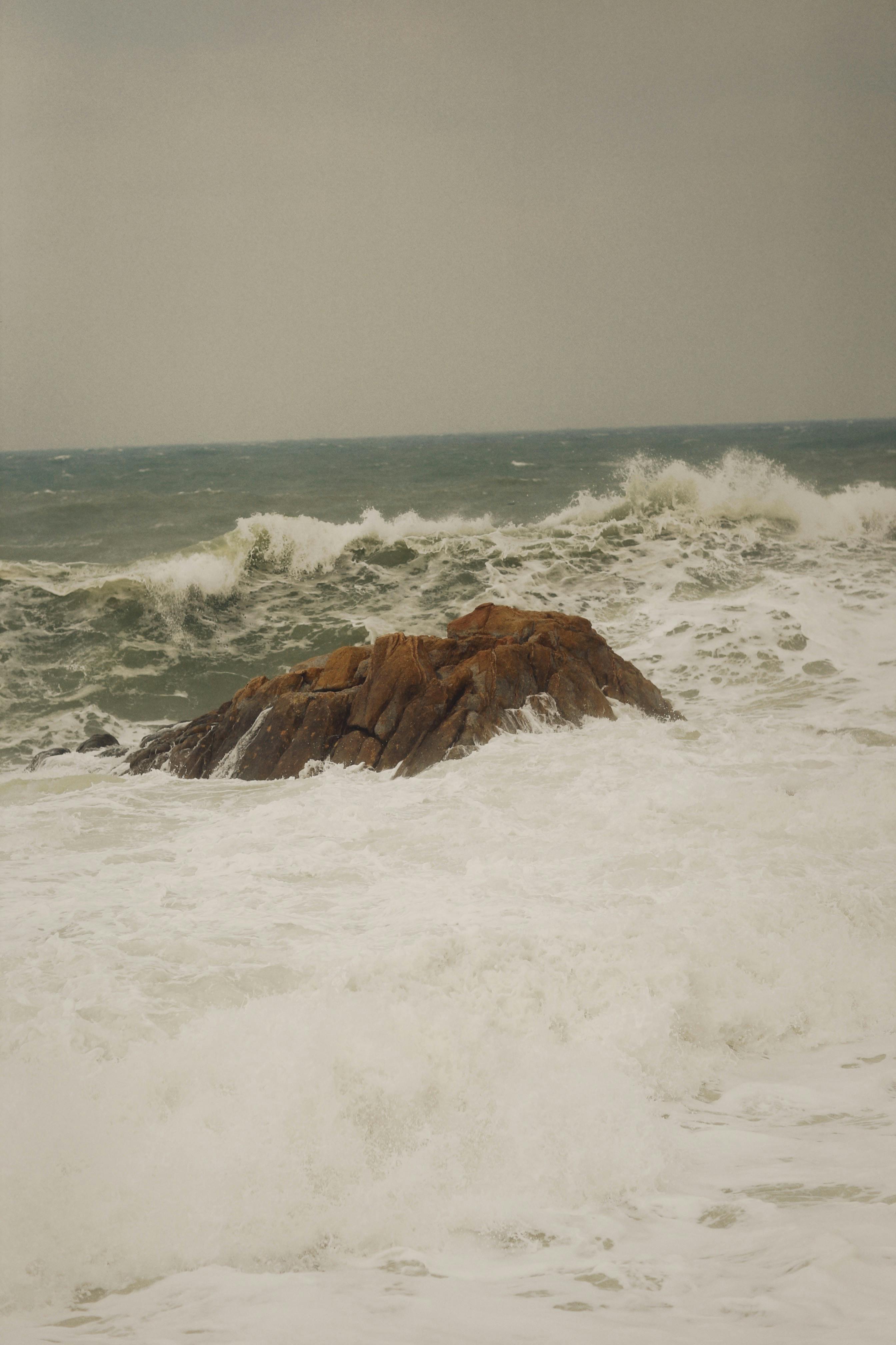 waves crashing on a rock