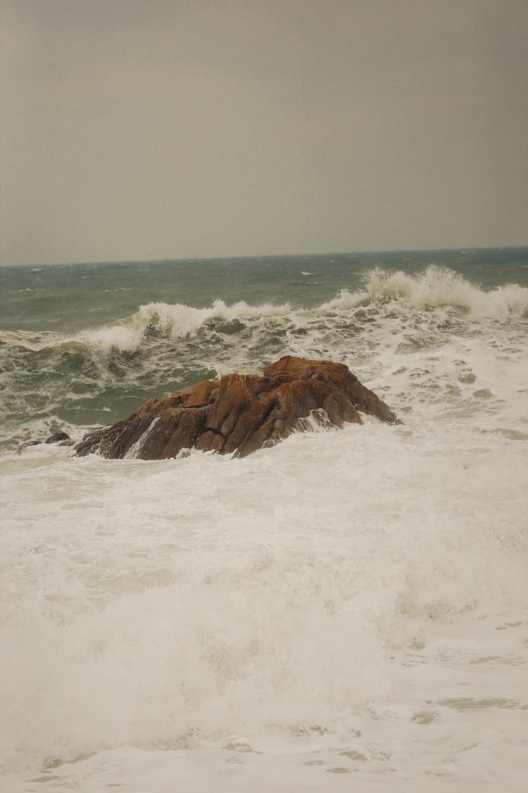 Waves Crashing On A Rock