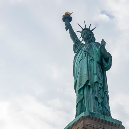 Free Iconic low angle view of the Statue of Liberty, a symbol of freedom in New York City. Stock Photo