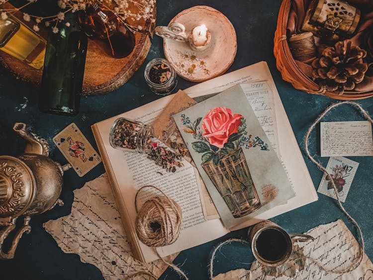 Still Life With Vintage Postcards And Decoration On A Green Table