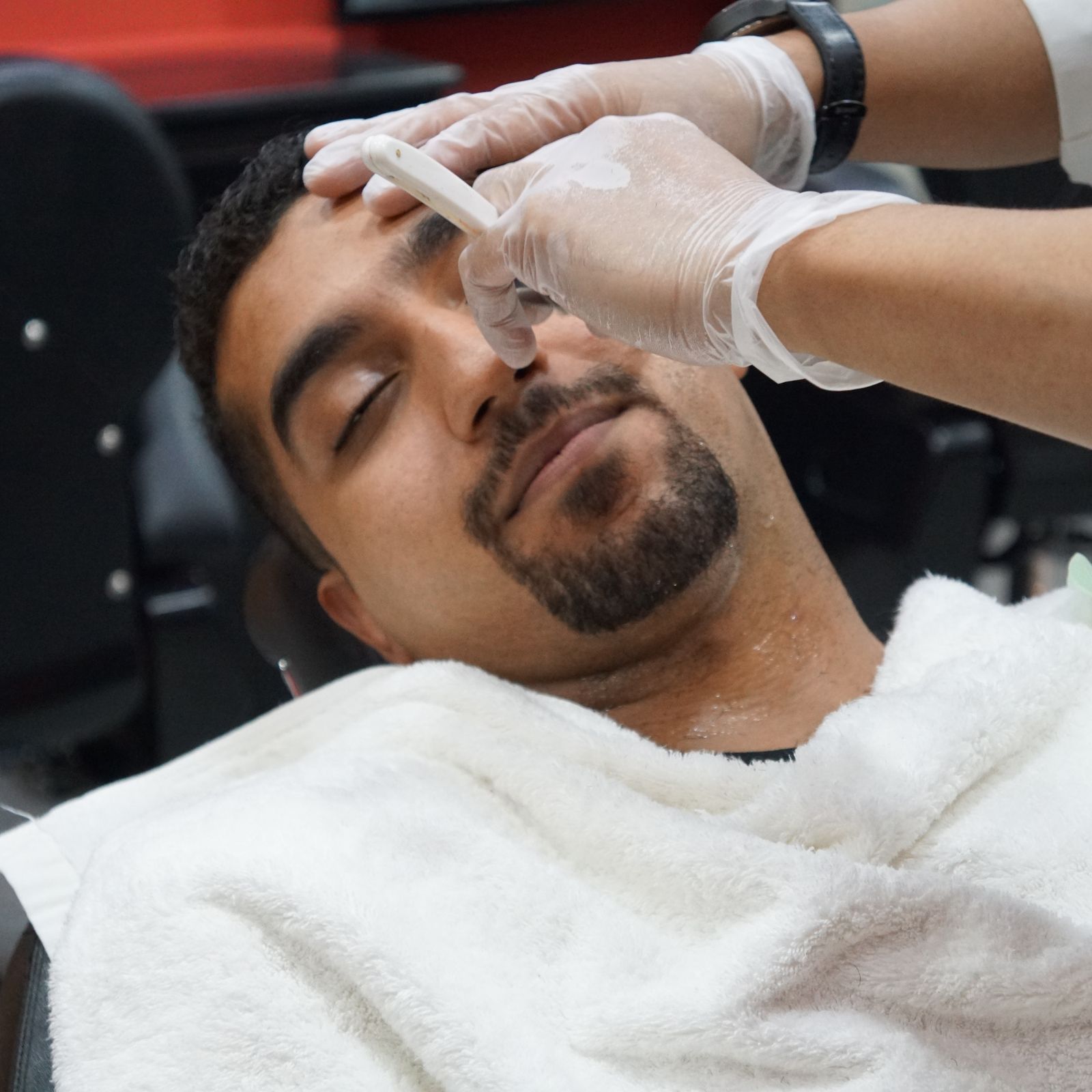 A relaxed client during a straight razor shave