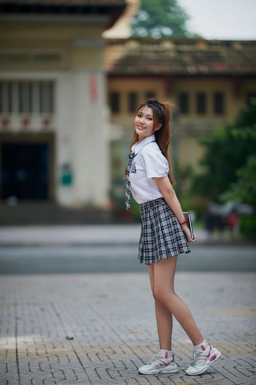 A Lady in School Uniform Standing · Free Stock Photo
