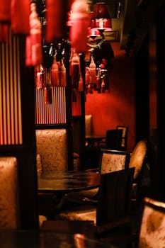 A luxurious oriental-themed restaurant interior with warm lighting and stylish decor.