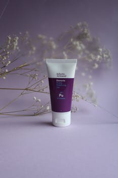 Product shot of a hydrating gel cream against a purple, floral backdrop.