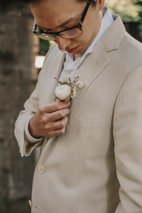 A Man with Boutonniere on His Suit