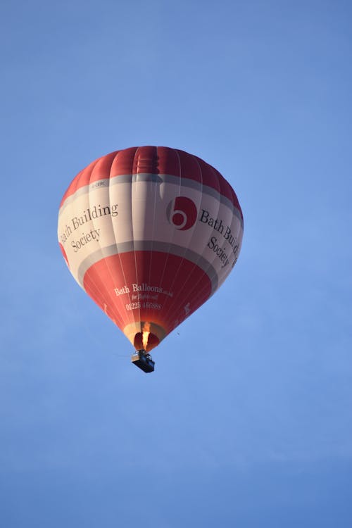 A Red Hot Air Balloon Flying in the Sky