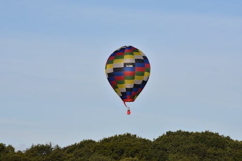 A Red Hot Air Balloon Flying in the Sky