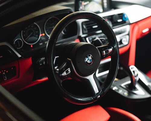 Free Close-Up Shot of a Black Steering Wheel Stock Photo