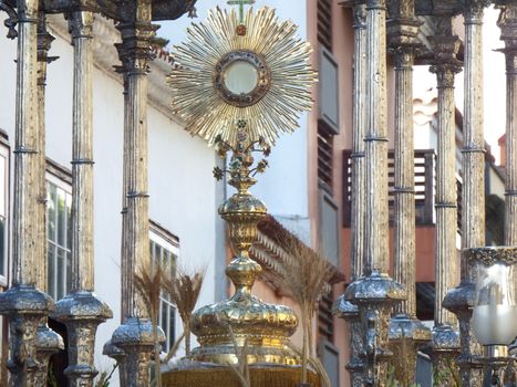 Adorned sun shaped ostensory during Christian procession