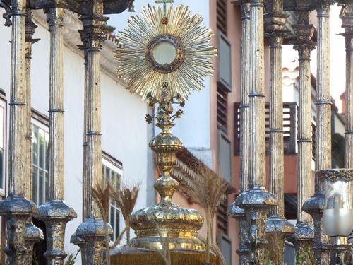 Free Golden ornate monstrance in shape of sunburst during Catholic procession in street of Spanish town Stock Photo