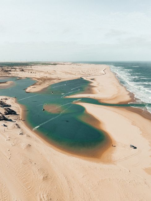 Stunning aerial shot capturing a tranquil Brazilian beach with unique sand formations and turquoise water.