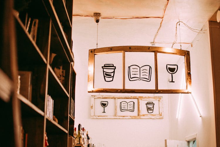 Shelves And Symbolic Cafe Icons On Wall